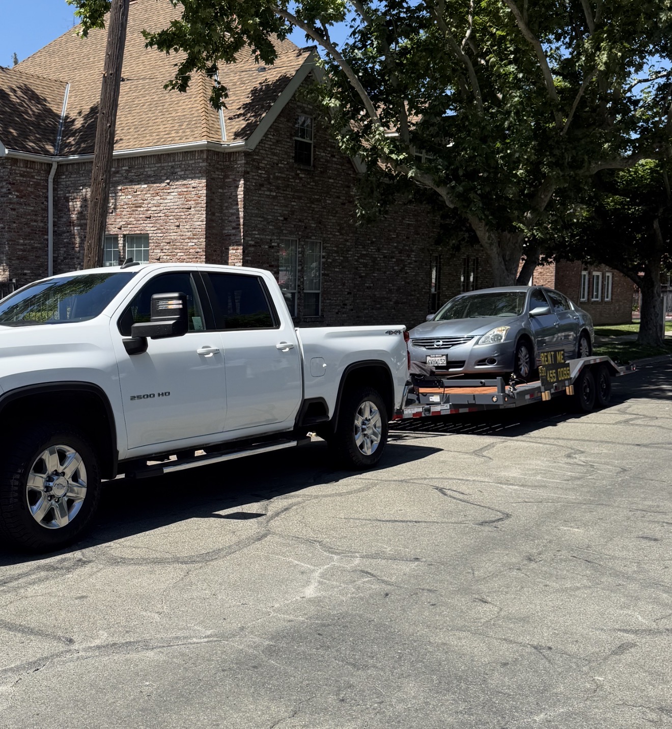 Sutter Rentals truck transporting a customer's vehicle